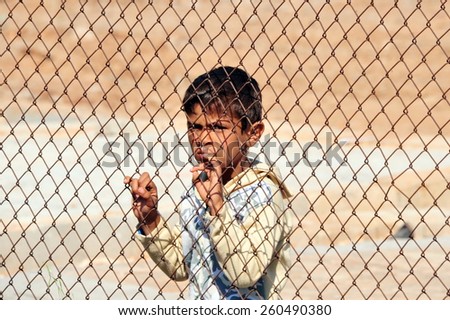 TURKISH-SYRIAN BORDER - APRIL  08, 2012: Unidentified Syrian child in refugee camp in Turkey  on April  08, 2012 the Turkish - Syrian border.