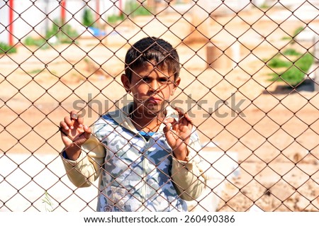 TURKISH-SYRIAN BORDER - APRIL  08, 2012: Unidentified Syrian child in refugee camp in Turkey  on April  08, 2012 the Turkish - Syrian border.