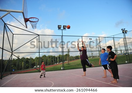 ISTANBUL, TURKEY - AUGUST  12:  Children play basketball in the city park on August 12, 2012 in Istanbul, Turkey.