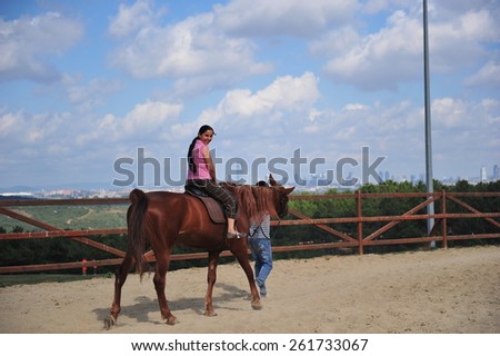 ISTANBUL ,TURKEY - JULY 21: Visitors who come to hippodrome to ride horses on July 21, 2012 in Istanbul, Turkey.