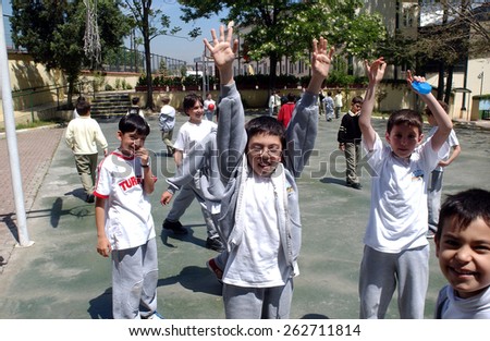 ISTANBUL, TURKEY - MAY 11: Turkish elementary school students in the school garden on May 11, 2006 in Istanbul, Turkey.