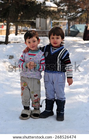 VAN, TURKEY - JAN 26: Earthquake victim children in the tent city.  at the earthquake of Van-Ercis on January  26, 2012 in Van, Turkey.