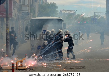 ISTANBUL - MAY 1: Many people can\'t take part in May Day march on May 1, 2014 in Istanbul. Police blocked all the ways to Taksim Square to prevent activists from joining their mates.