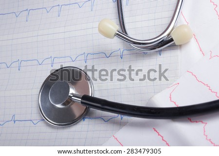 Cardiogram pulse trace and stethoscope concept for cardiovascular medical exam, closeup