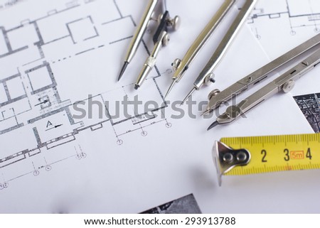 Architectural project, blueprints and divider compass, folding ruler on plans. Engineering tools view from the top. Copy space. Construction background.