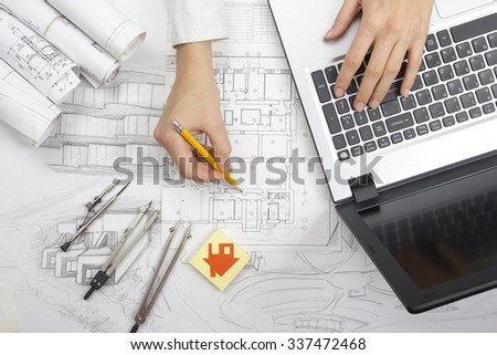 Architect working on blueprint. Architects workplace - architectural project, blueprints, laptop and divider compass, pencil. Construction concept. Engineering tools. Top view