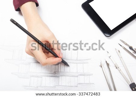 Architect working on blueprint. Architects workplace - architectural project, blueprints, pencil, blank tablet pc and divider compass. Construction concept. Engineering tools. Cope space for text.