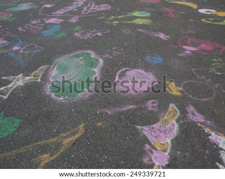 Colored chalks. Colored chalk on playground with drawings on street