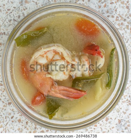 Tom Yam Kung , big shrimp favorite spicy thai cuisine food with herb , lemon grass and lime