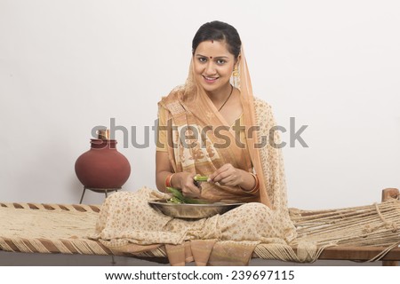 indian house wife cutting vegetable