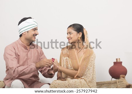 Husband gifting to his wife