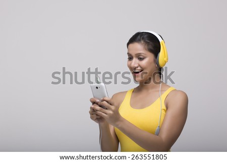 Indian female teenager listening to music