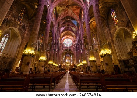 Palma de Mallorca, Spain, July 18 2014: Believers and tourists visit the church of La Seu, is one of the most popular places in the city