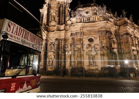 Dresden, Germany, January 06 2015: View of Hofkirche with a tour bus in the foreground at night time