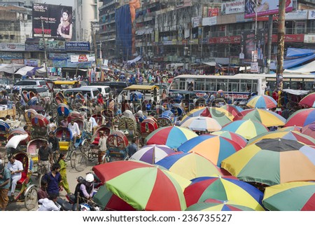 DHAKA, BANGLADESH - FEBRUARY 22, 2014: People go for shopping at the Old market on February 22, 2014 in Dhaka, Bangladesh. Dhaka is one of the most overpopulated cities in the world.