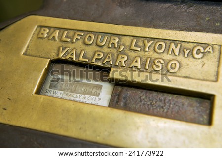 VALPARAISO, CHILE - OCTOBER 19, 2013: Vintage mechanical passenger counter exterior plate at El Peral funicular lower station on October 19, 2013 in Valparaiso, Chile.