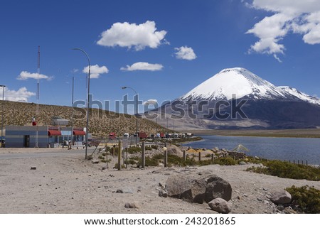 CIRCA PUTRE, CHILE - OCTOBER 22, 2013: Queue of trucks wait at the Chile-Bolivia border control at the territory of Lauca National park at 3.200 meters AMSL on October 22, 2013 circa Putre, Chile.
