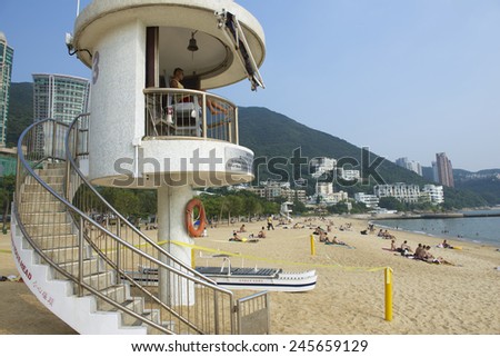 HONG KONG, CHINA - SEPTEMBER 16, 2012: Unidentified life guard on duty at Stanley town beach on September 16, 2012 in Hong Kong, China. Stanley town is a tourist attraction in Hong Kong.