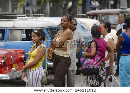 HAVANA, CUBA - OCTOBER 23, 2006: Unidentified people wait in the queue for taxi on October 23, 2006 in Havana, Cuba. Public transportation in Cuba is at very low level.