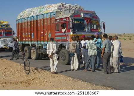 JAMBA, INDIA - APRIL 02, 2007: Unidentified truck drivers talk on the road on April 02, 2007 in Jamba, India.