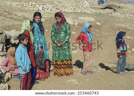 ISFAHAN, IRAN - JUNE 22, 2007: Unidentified young women talk, circa Isfahan, Iran. Some Bakhtiari people in Iran still follow nomadic lifestyle and wear traditional dresses daily.