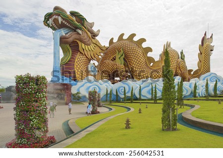SUPHAN BURI, THAILAND - AUGUST 19, 2011: Unidentified people walk in front of the Dragon Descendants museum on August 19, 2011 in Suphan Buri, Thailand.
