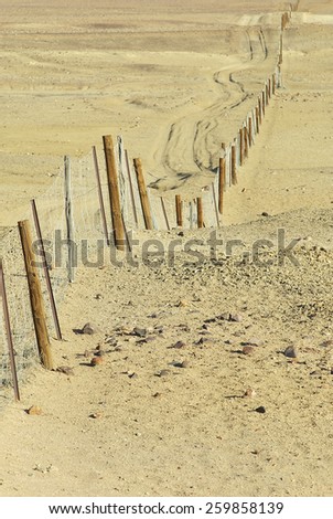 Dingoe fence in the Australian Outback. The fence is 9600 kilometers long, it keeps the dingoe dogs out of the areas, where the sheep graze.