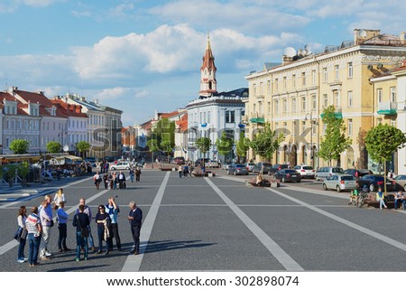 VILNIUS, LITHUANIA - MAY 05, 2015: Unidentified tourists walk by the Town Hall square in Vilnius, Lithuania.