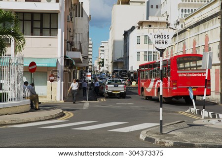 PORT LOUIS, MAURITIUS - NOVEMBER 29, 2012: View to the street with pedestrian crossing in downtown Port Louis, Mauritius.
