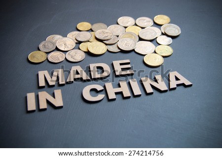 Made in China concept written with wooden letters on blackboard. Its a business concept with a studio shot.