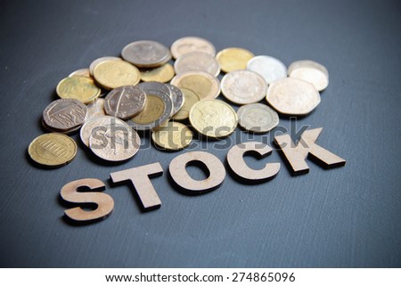 Business stock and share concept written with wooden letters on blackboard. This photo can use as Business background.