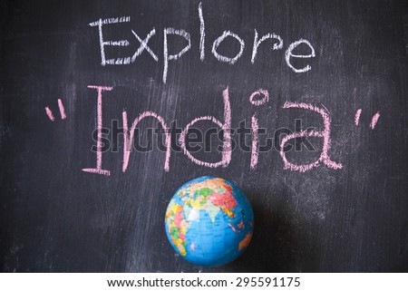 Explore word written on blackboard with chalk. Concept is to discover a new country. This photo may use as travel and living background.