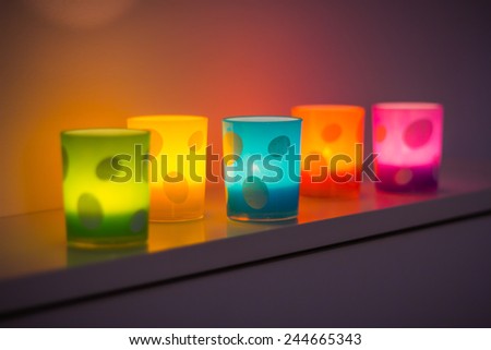Candle jars, colorful.