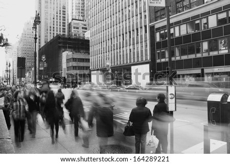 New York City, NY, USA, March 31, 2010. Pedestrians walking on a boardwalk along an avenue in New York City