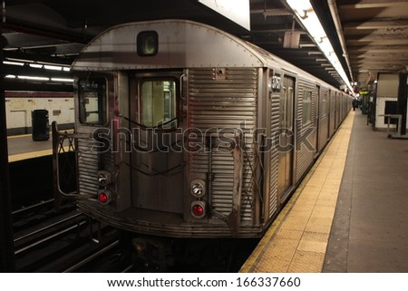 New York, NY, USA, January 19, 2013: Close up of a metal train of the Subway line 1, New York City, USA, beside the Platform with closed doors.