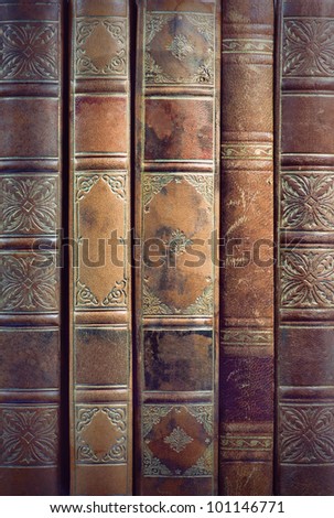 Close up of backs of vintage leather books