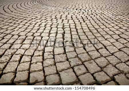 Background of street paved with cobble stones