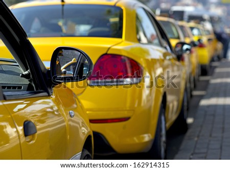 Taxi cabs lined up waiting for customers