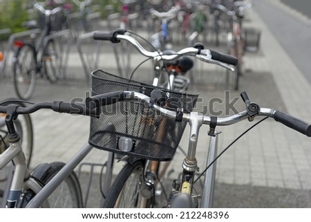 bikes on bicycle park on gloomy rainy day
