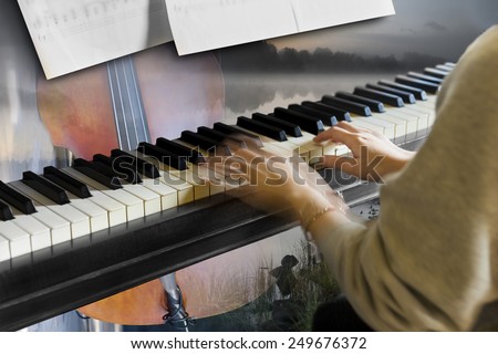 Hands of young woman playing the piano with other instrument and beautiful landscape in background