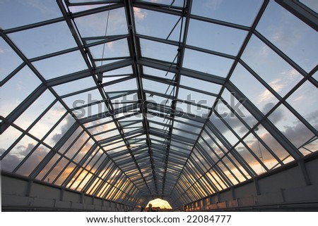 Evening sky seen through a glass ceiling