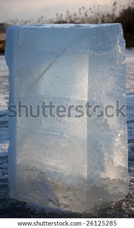 Big block of ice in evening sunlight