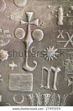 Religious symbols on a metal door