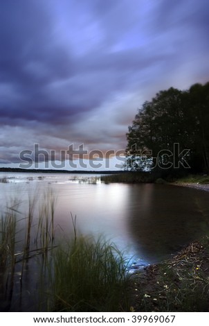 Tranquil scene of a small lake in the late evening