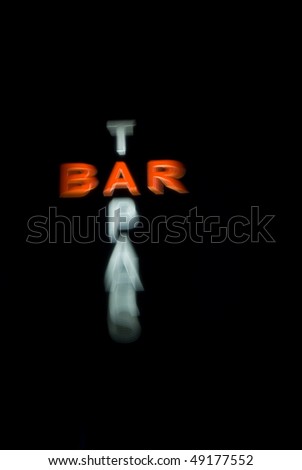 Blurred neon tapas bar sign in red