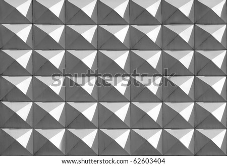 Background of symmetrical pattern with pyramid shapes
