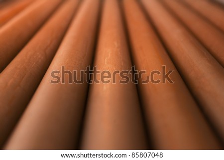 Close up of rusty metal pipes with diminishing perspective