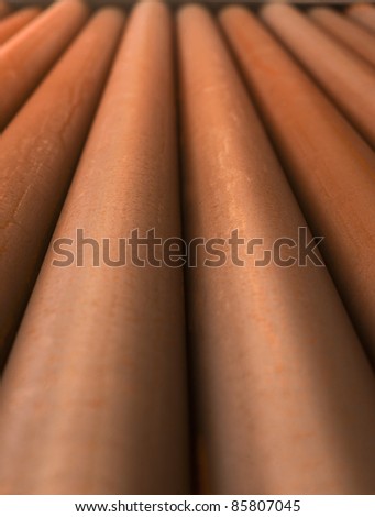 Close up of rusty metal pipes with diminishing perspective