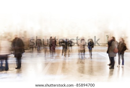 A crowd of people in a museum or at an exhibition A crowd of people in a museum or at an exhibition