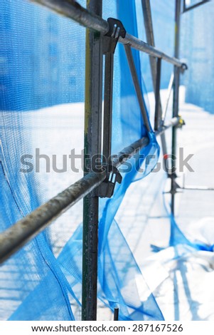 Close up of debris netting on scaffolding, seen from inside